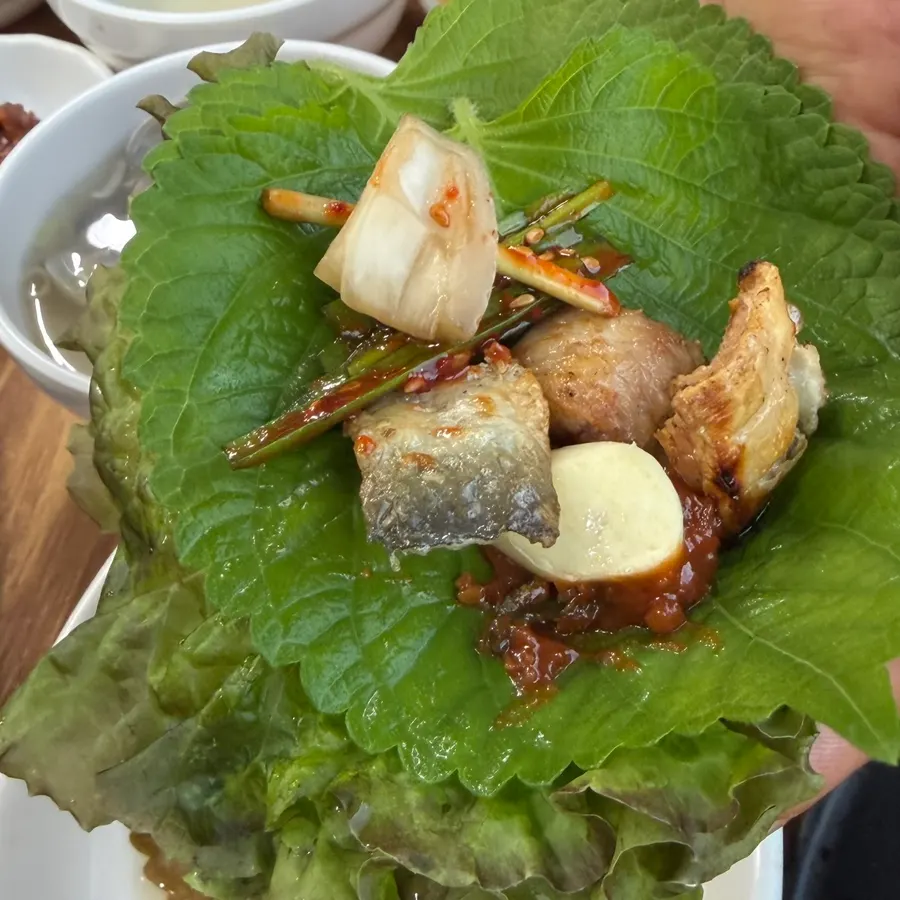 Eel ssam with dressed chives and vegetables