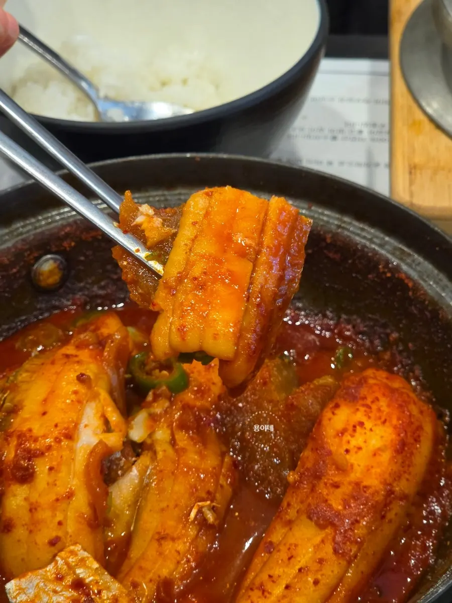 Finishing a fish stew meal at Jeju Badang