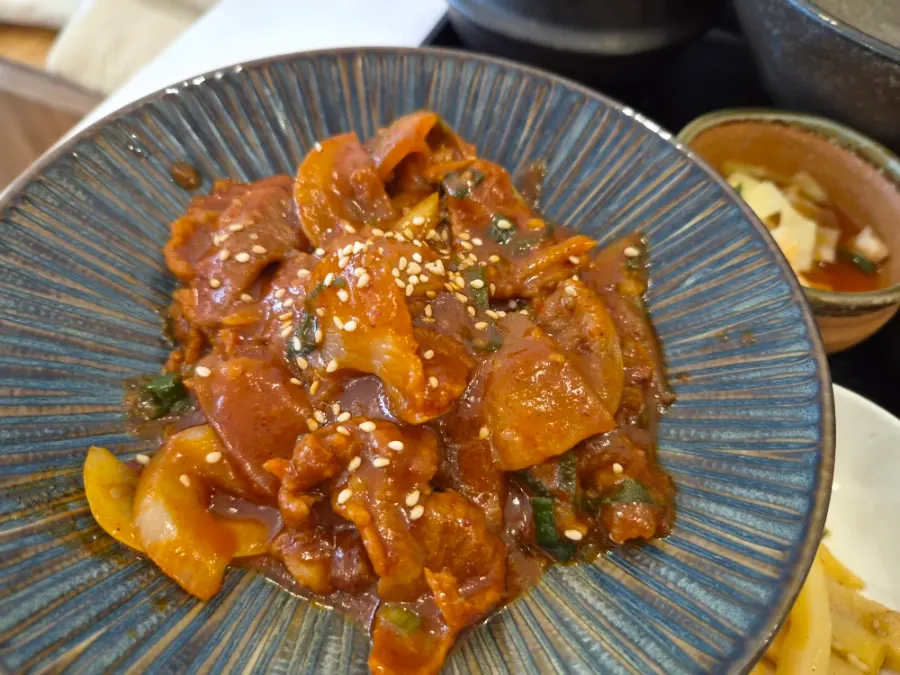 Spoonful of gondre rice topped with gochujang bulgogi