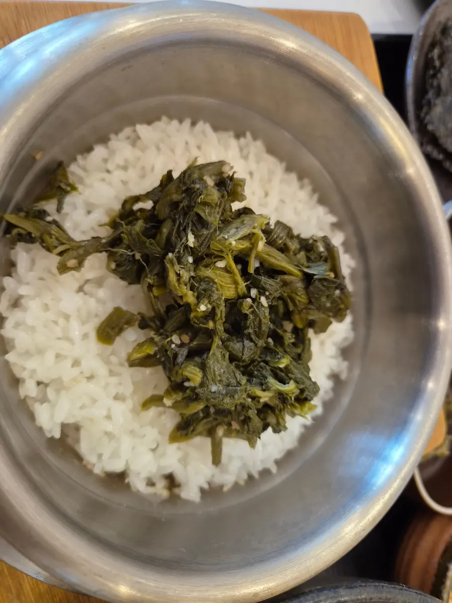 Gondre stone pot with rice scooped out and water poured in