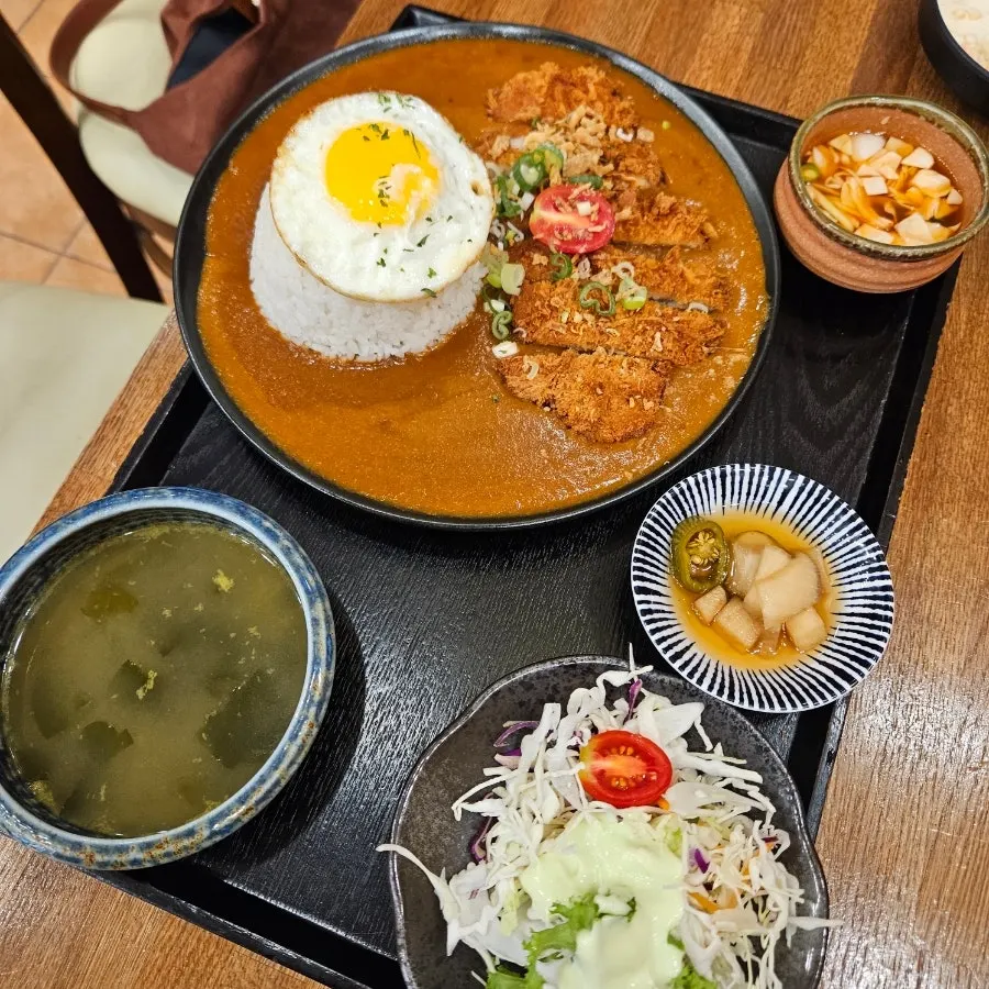 Oneul Haru's pork cutlet curry topped with a fried egg