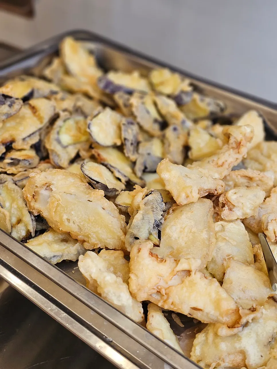 Tteokbokki and eggplant/king oyster mushroom fritters at the self-serve bar