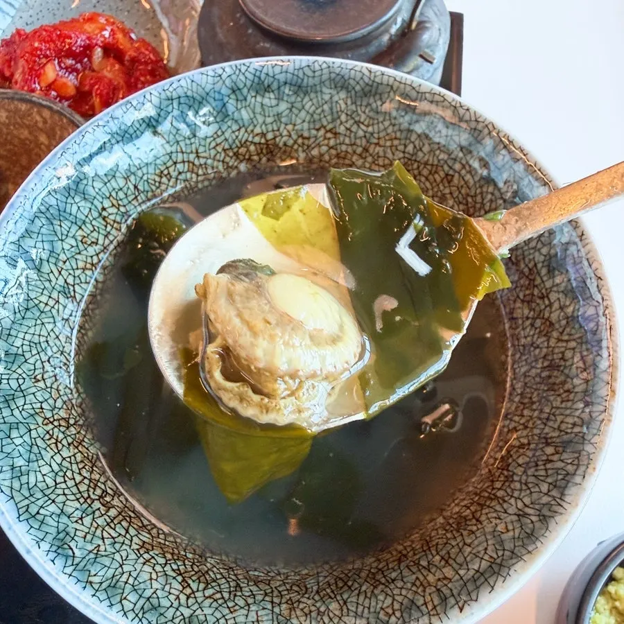 Complimentary seaweed soup with scallops