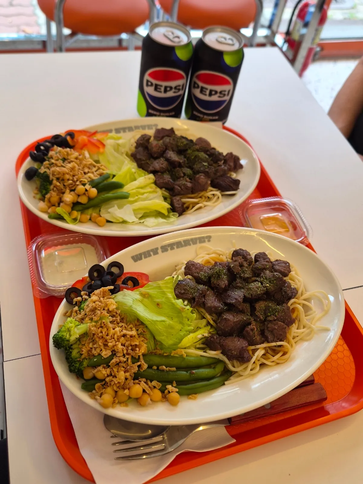 Chicken and beef bowls placed on the table