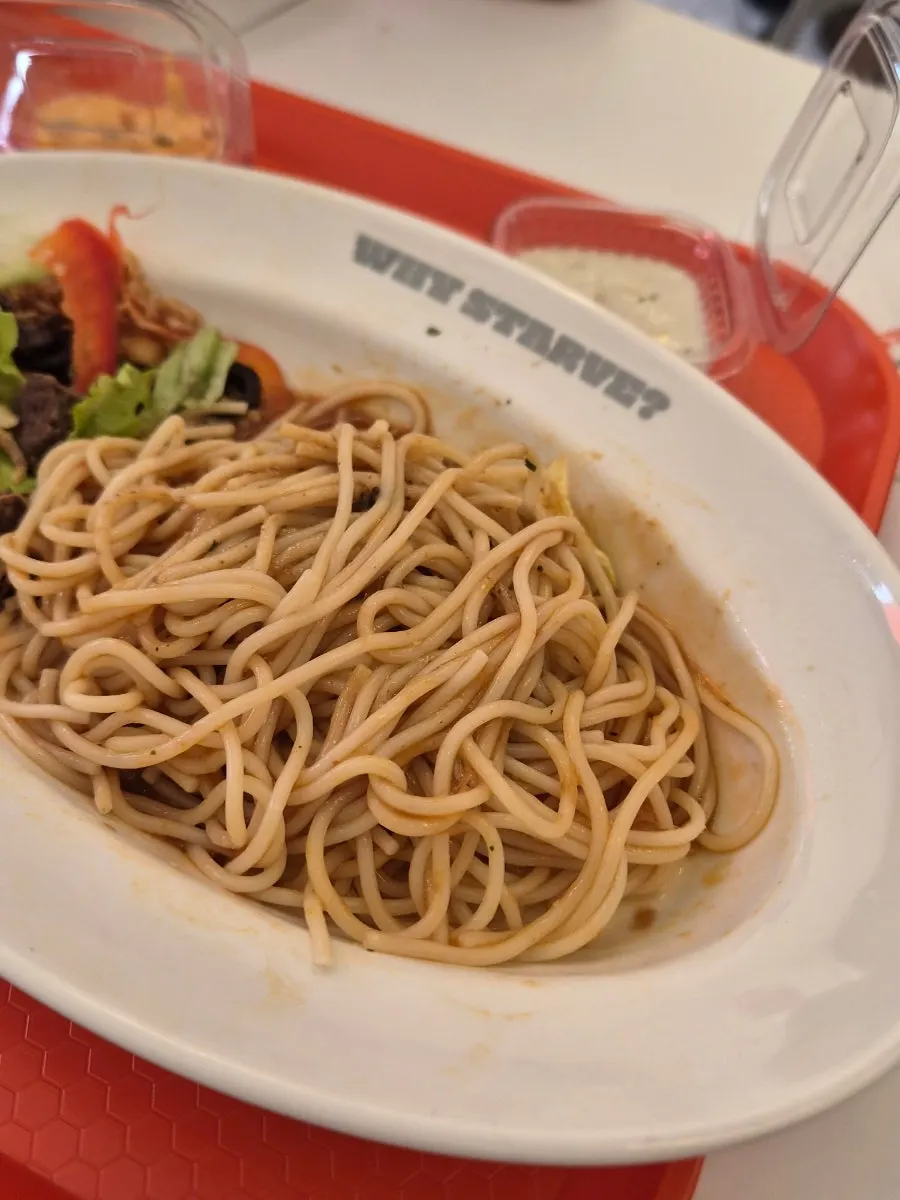 Bowl of pasta-noodle beef being mixed