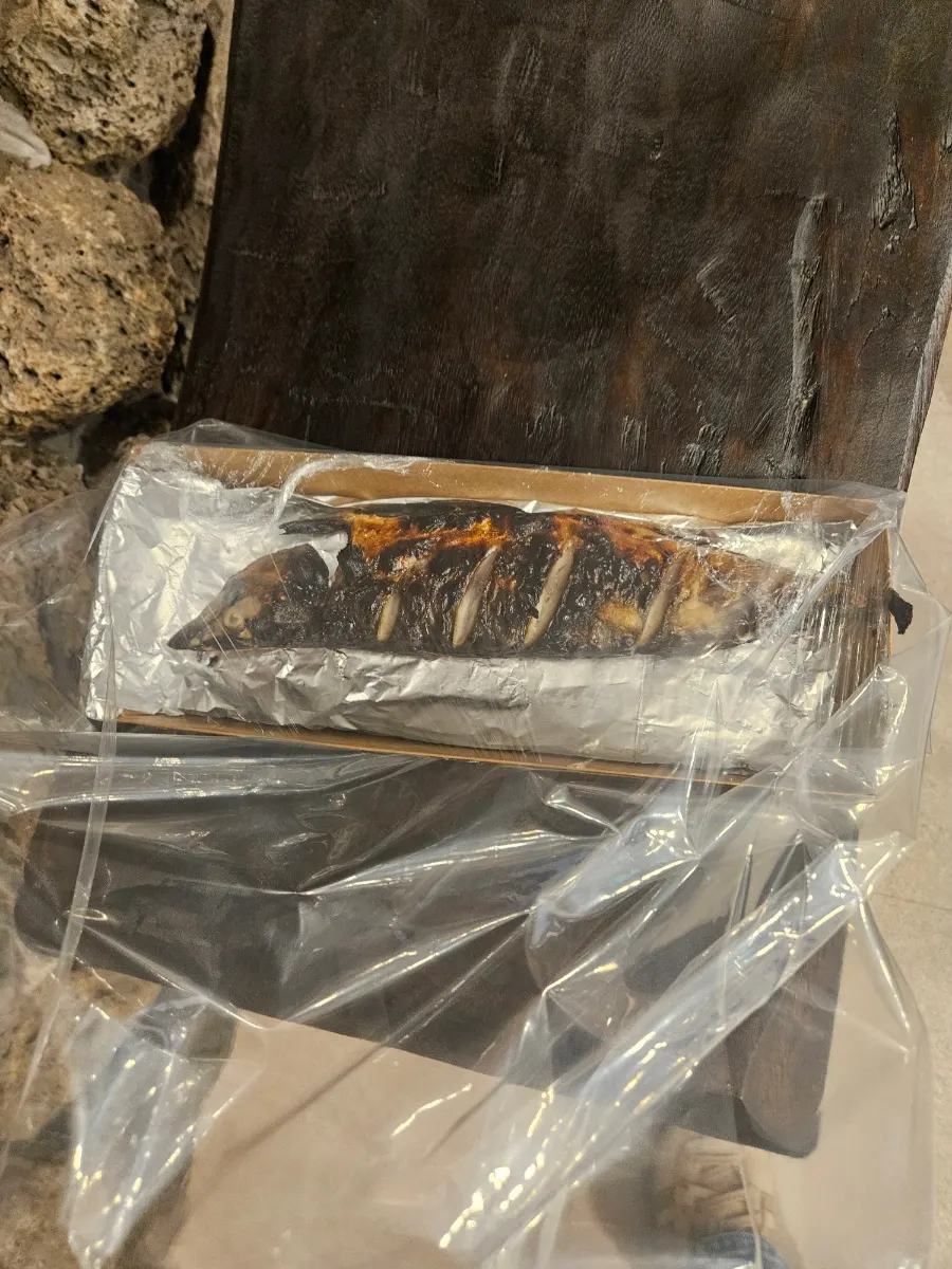 Grilled mackerel packed for takeout