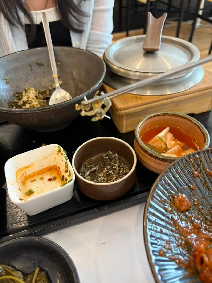 Neatly presented Korean side dishes and braised anchovies