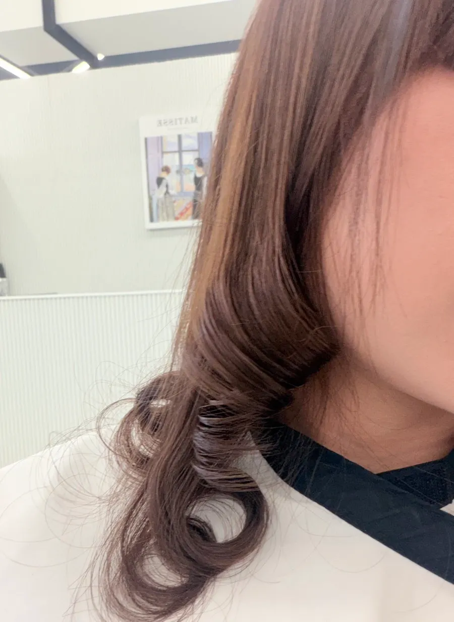 Hair taking shape into a C-curl