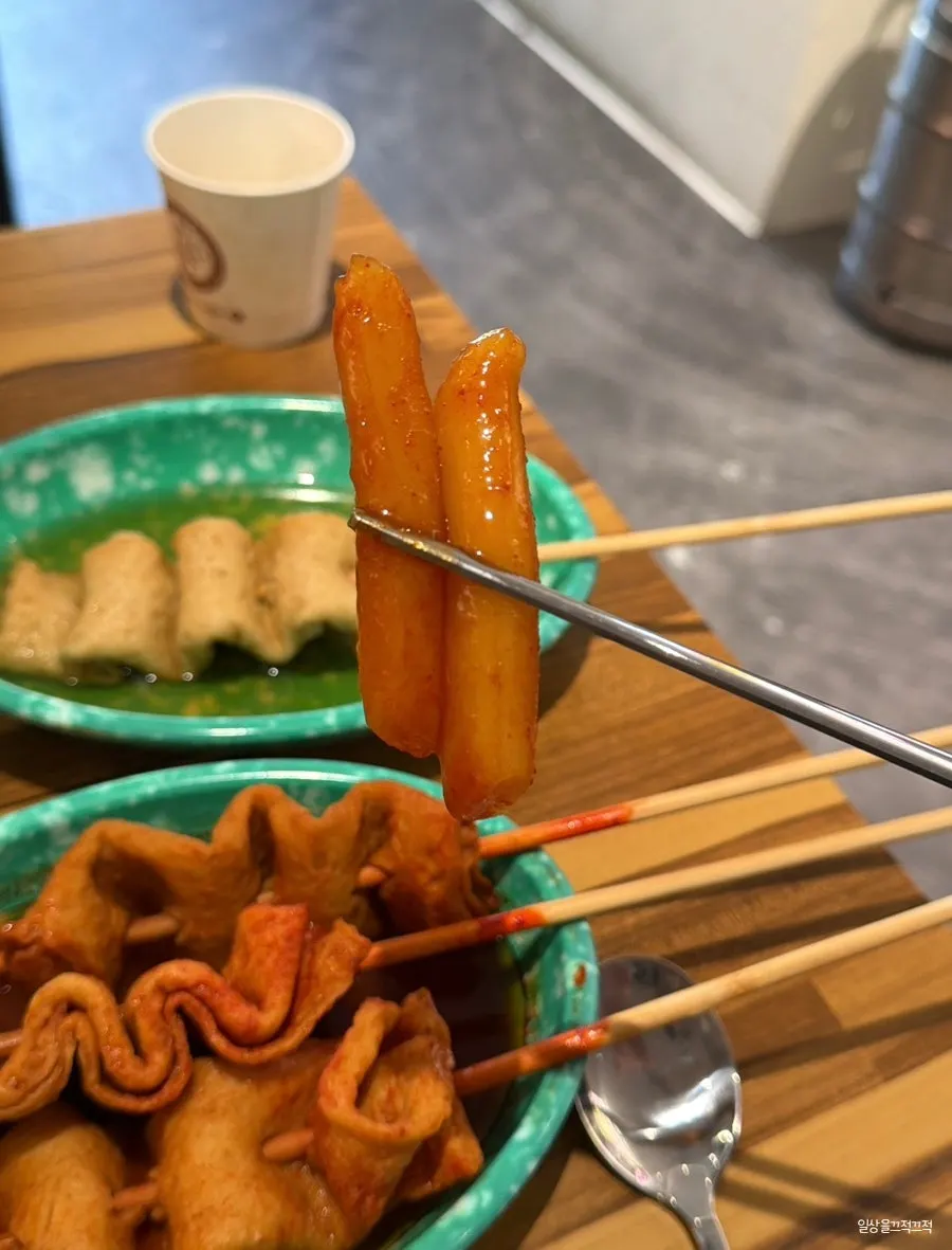 Table spread of tteokbokki and Korean snack dishes