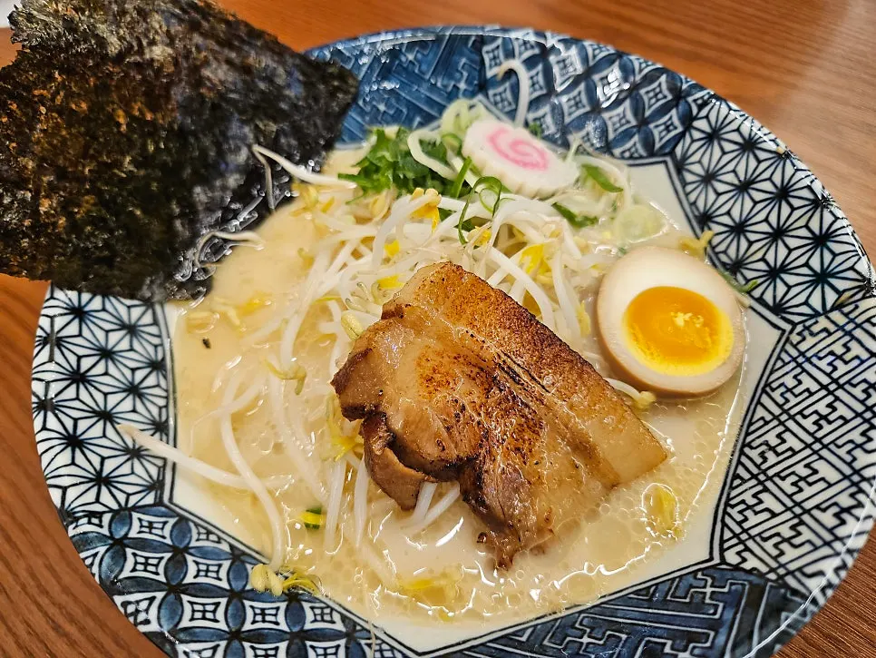A bowl of tonkotsu ramen topped with chashu and tamago