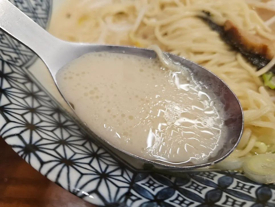 Close-up of the pork bone broth in the tonkotsu ramen