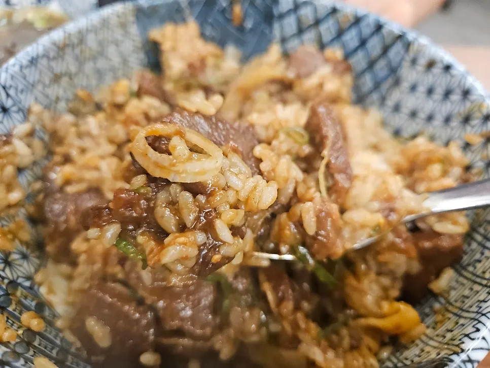 Butadon rice bowl topped with egg yolk