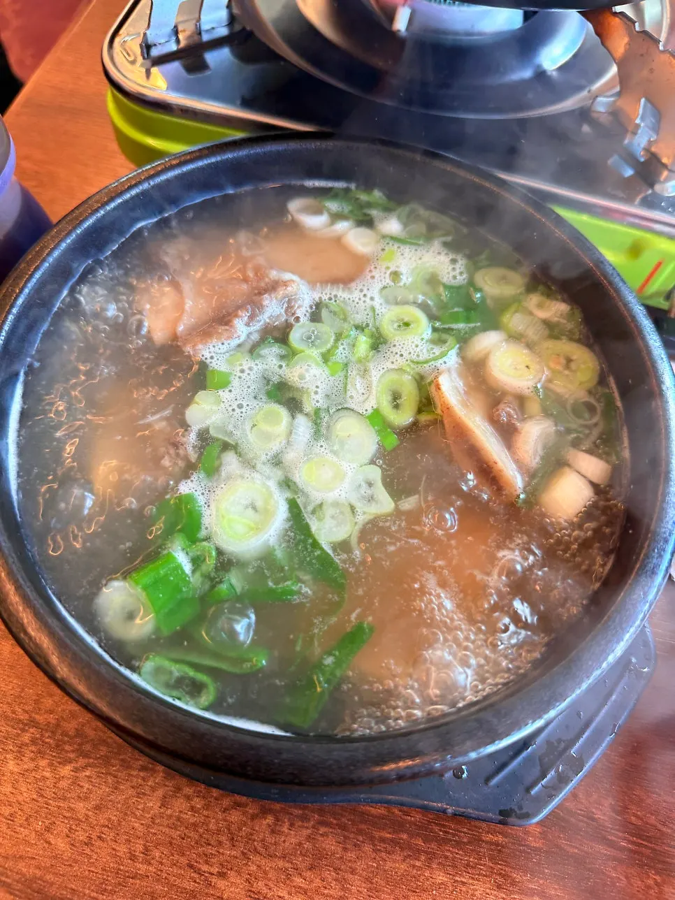 Pot of spicy braised pork ribs starting to boil
