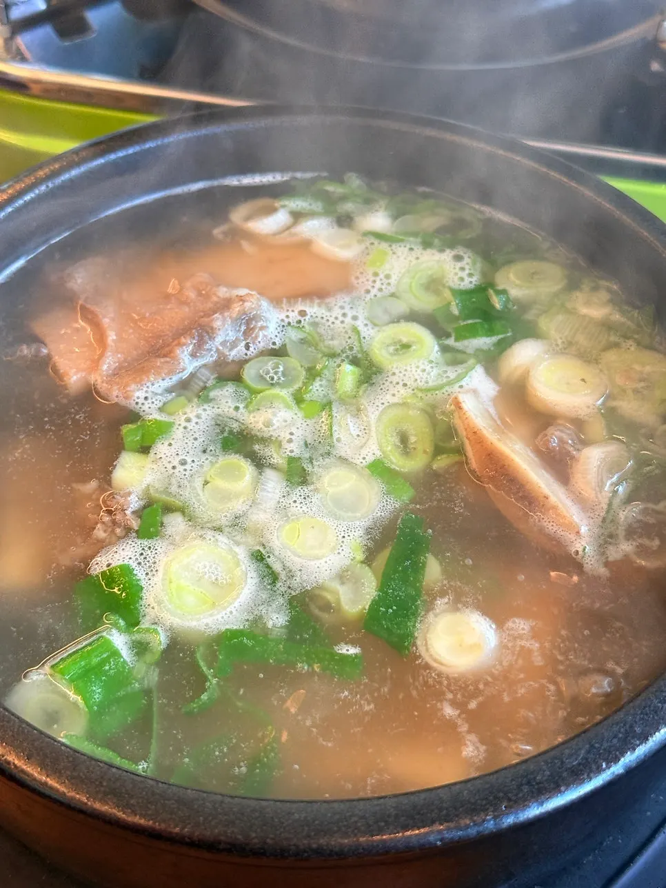 Braised pork ribs simmering with a 12-minute timer