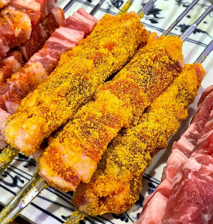Original, curry, and plain lamb skewers