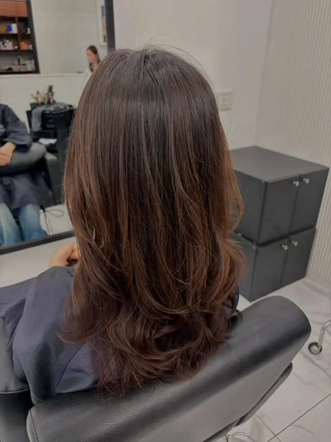 Before-and-after comparison of a long-hair perm