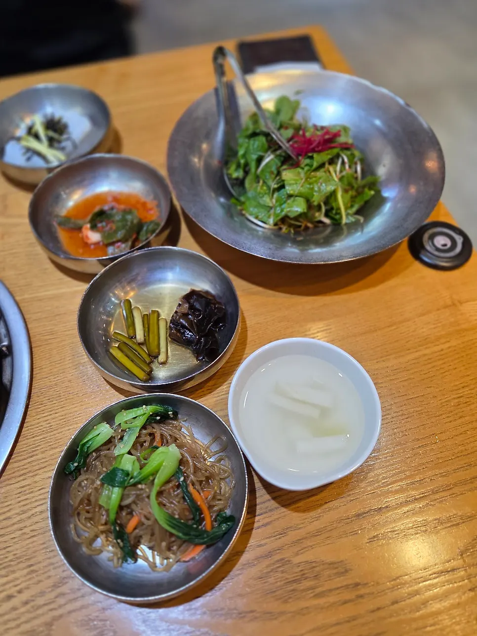 Plates of side dishes set out on the table