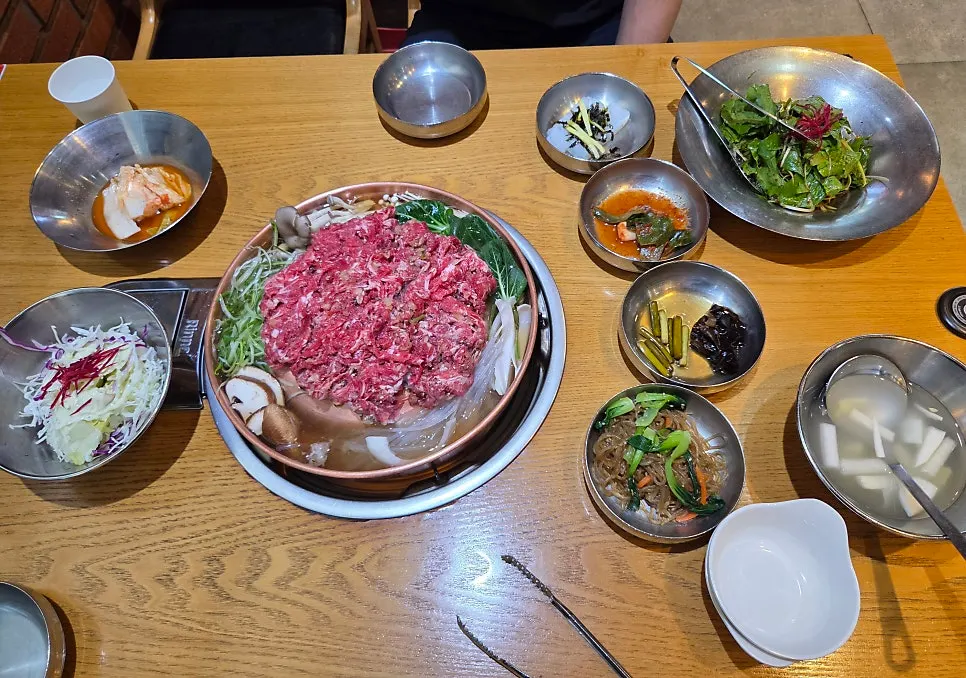 Hanwoo raw bulgogi piled in the hot pot