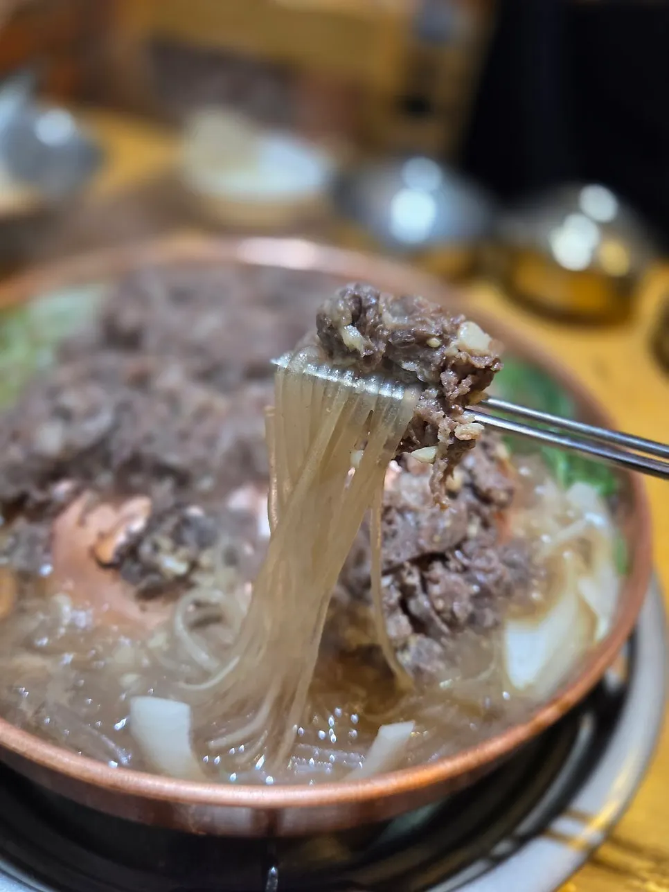 The full table spread of hanwoo raw bulgogi and side dishes