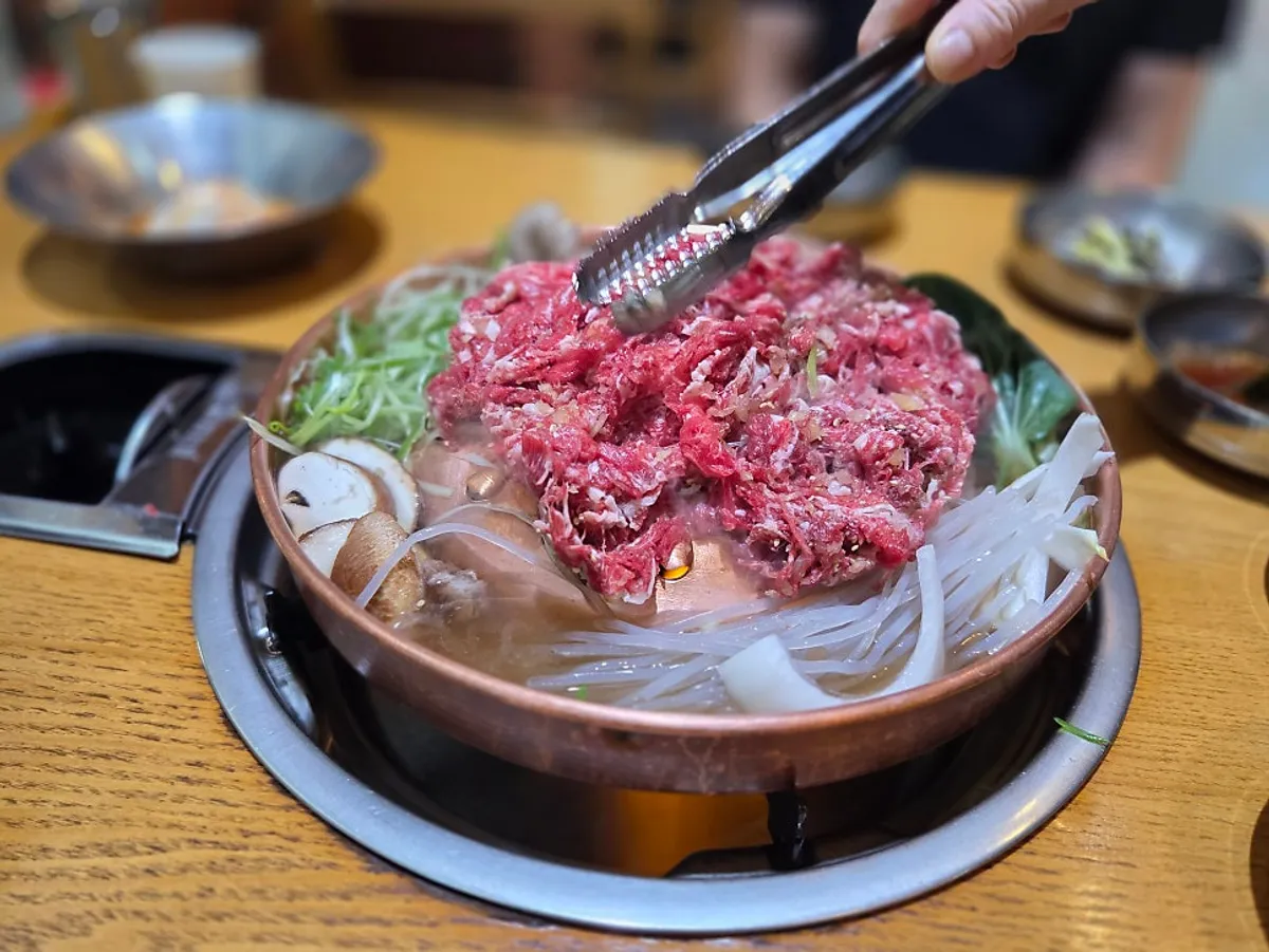 The full spread with the hanwoo raw bulgogi hot pot