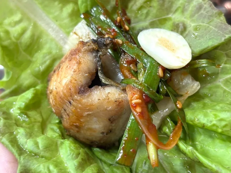 A wrap of eel with baek-kimchi