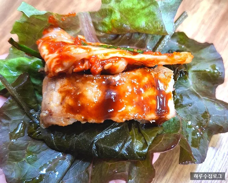 Eel sushi topped with perilla leaf pickles and cabbage salad