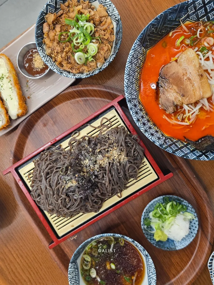 A full spread of pan momil and mala ramen