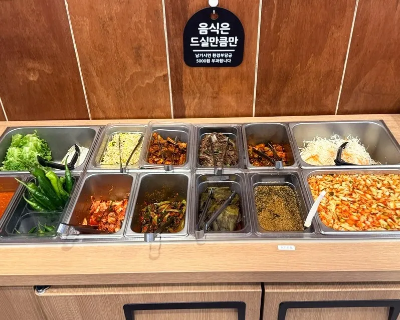 Self-serve bar with assorted side dishes
