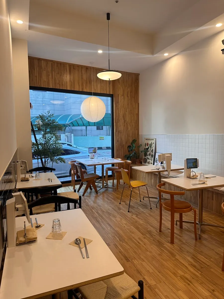 Seating at Oneul Haru lit by sunlight through big windows