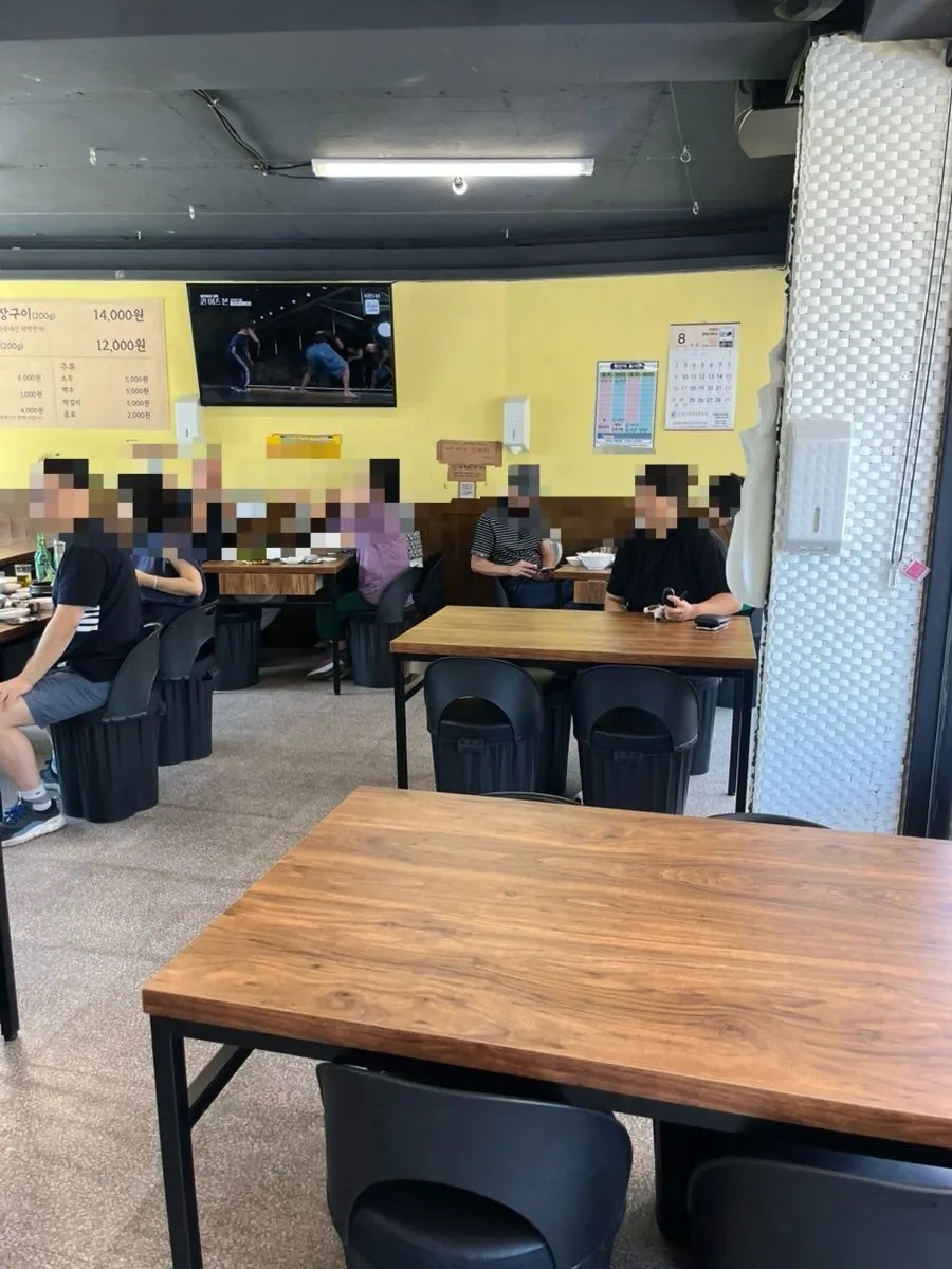 Ttukbangjip dining hall with spaced-out tables