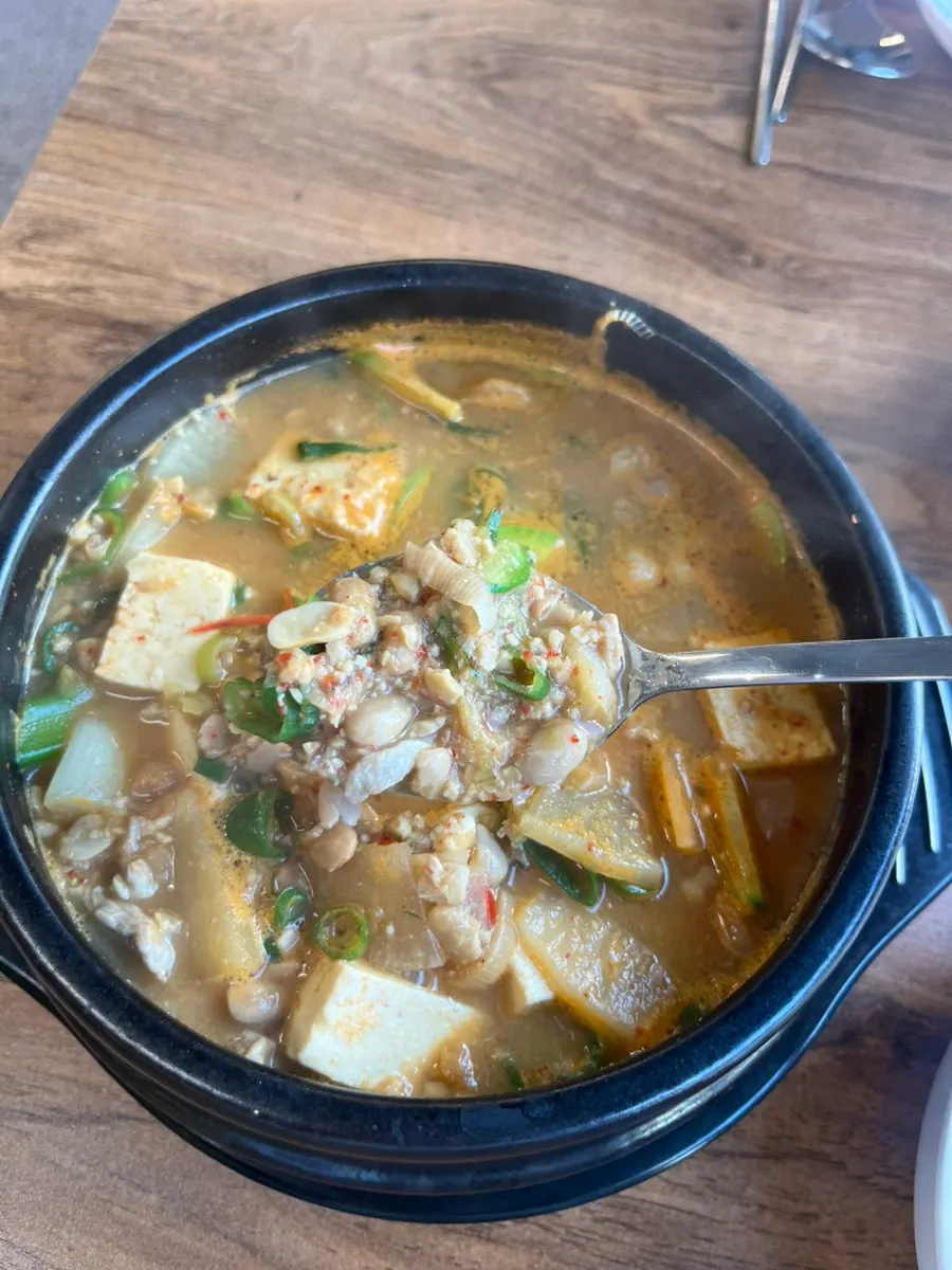 Cheonggukjang served alongside a meat order