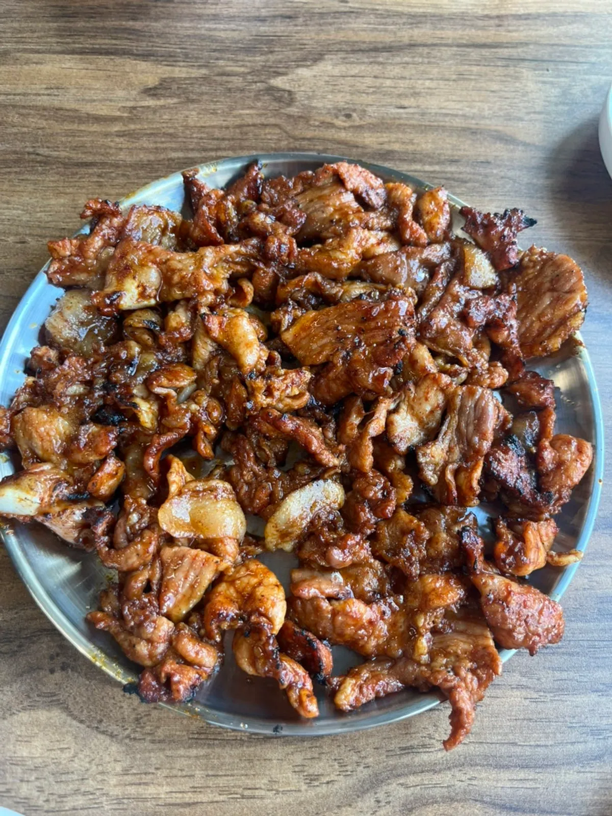 A plate piled high with charcoal gochujang pork