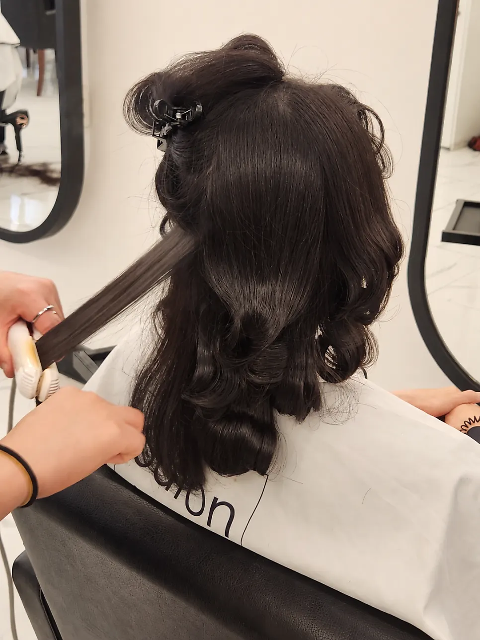 Arranging the curls after removing the rods