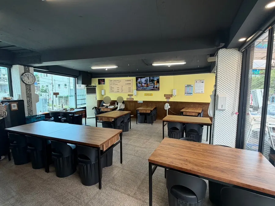 Interior of Ttukbangjip with generously spaced tables