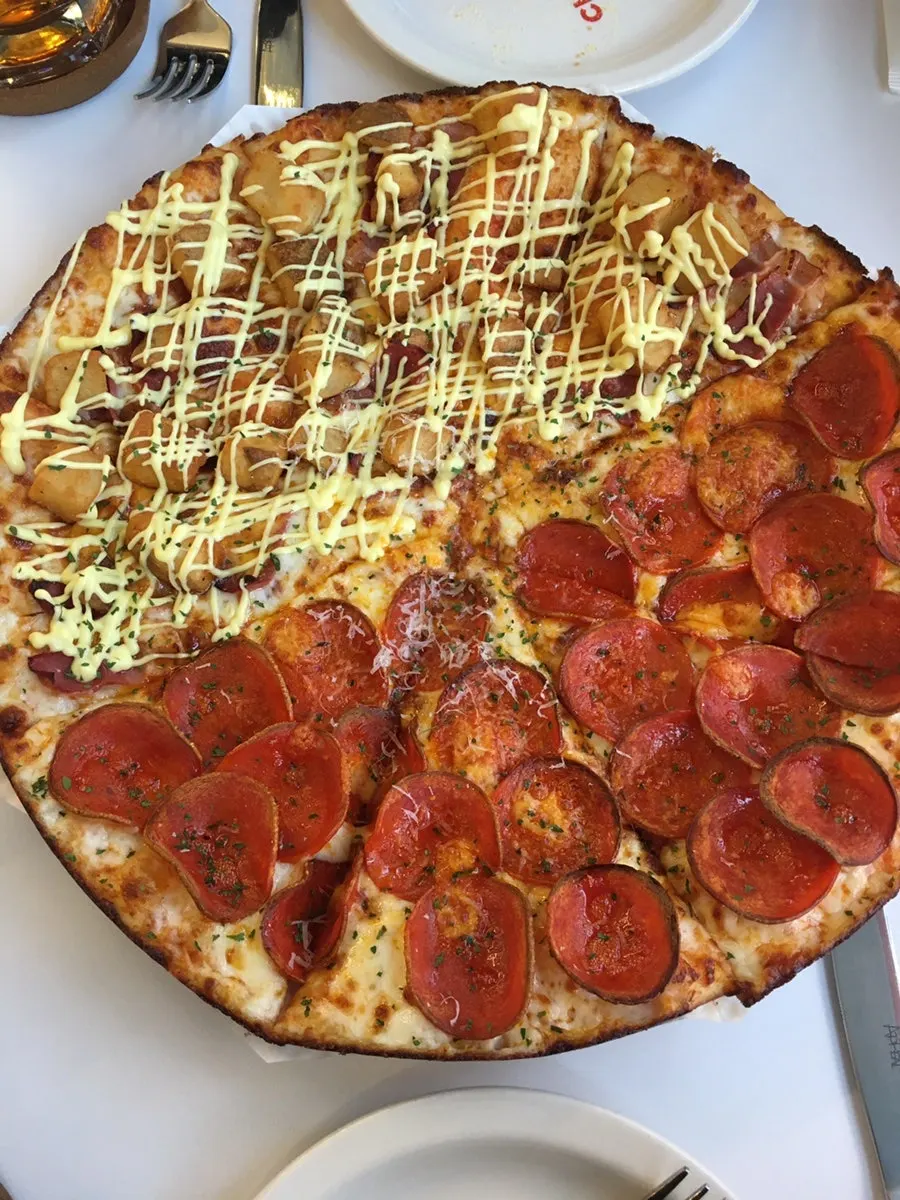 Half-and-half pizza with pepperoni and bacon potato