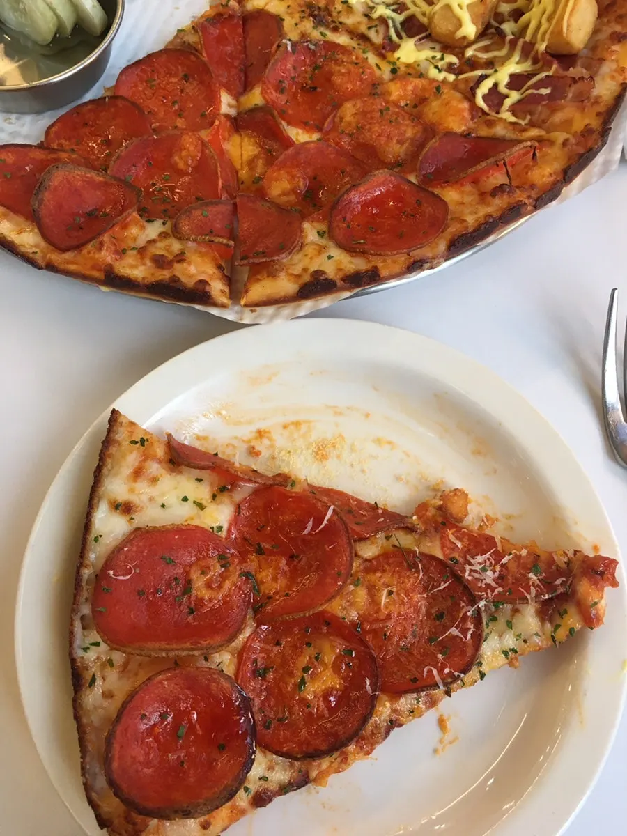 The plate left over after finishing the pizza