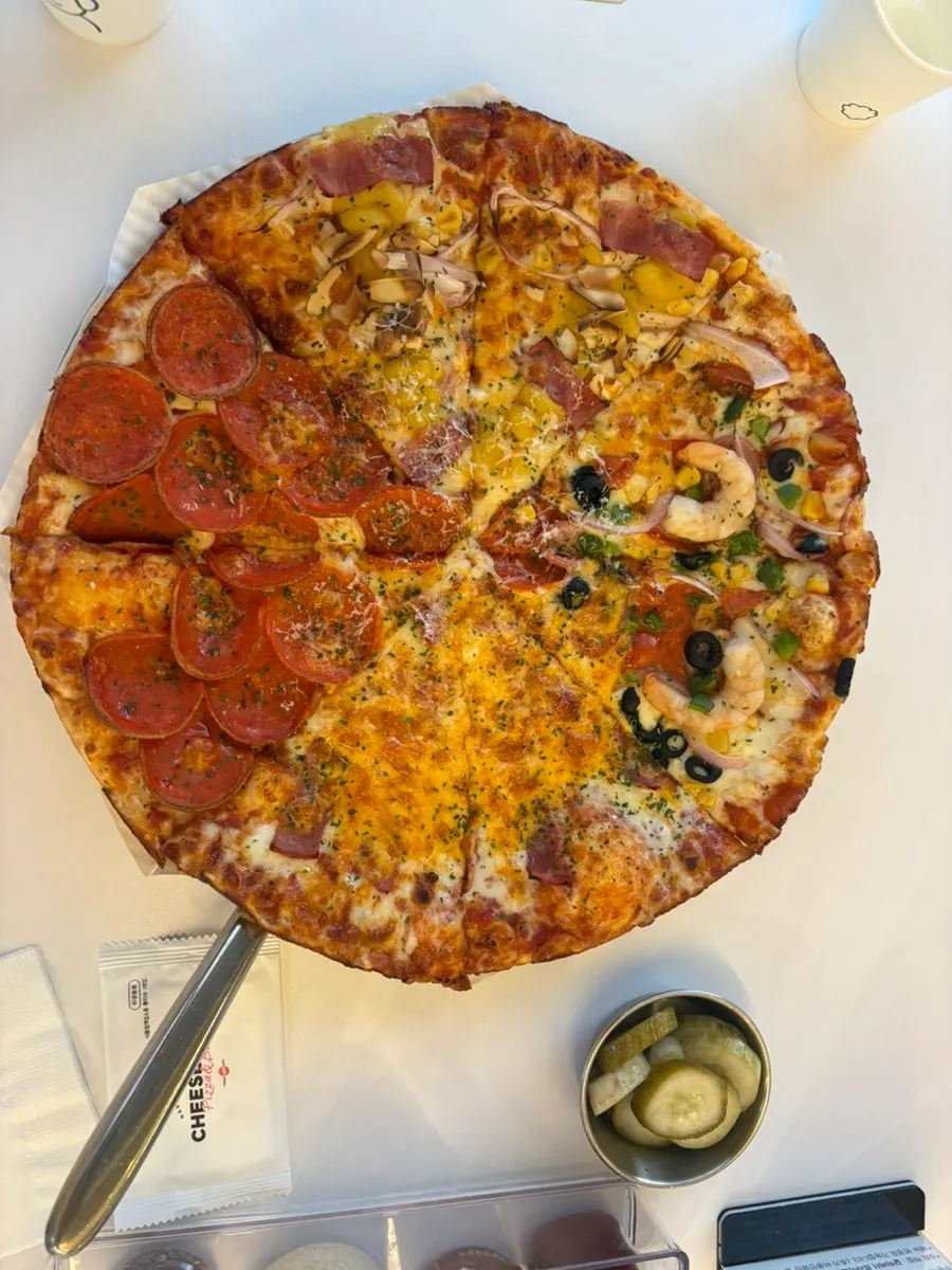 A slice of pizza with a thin edge crust