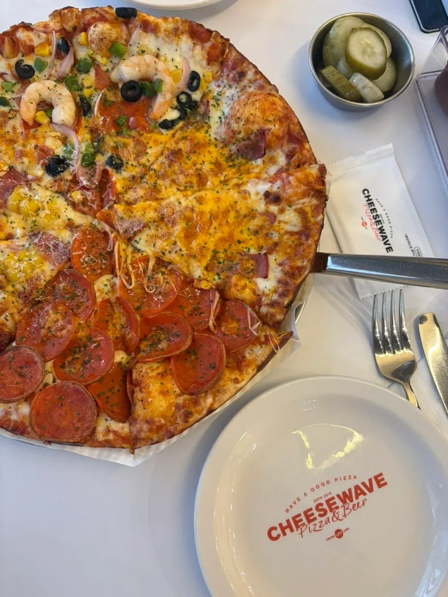 Cross-section of a pizza slice with stretchy cheese
