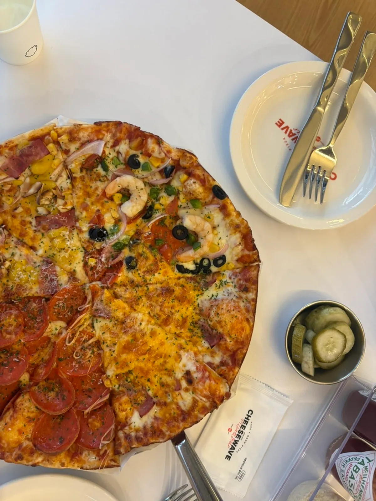 Sundried shrimp pizza topped with shrimp and sundried tomato