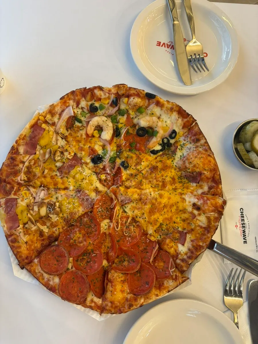 Sweet potato pizza slice topped with sweet potato mousse