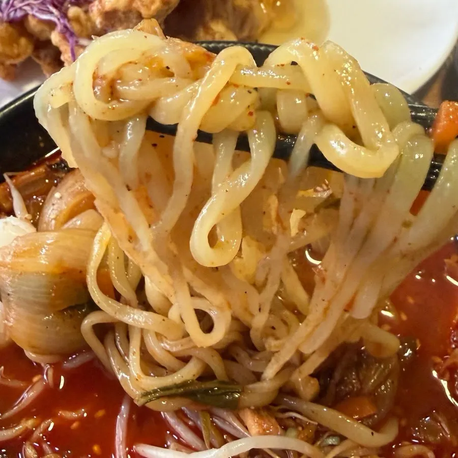 Close-up of chewy jjamppong noodles soaked in broth
