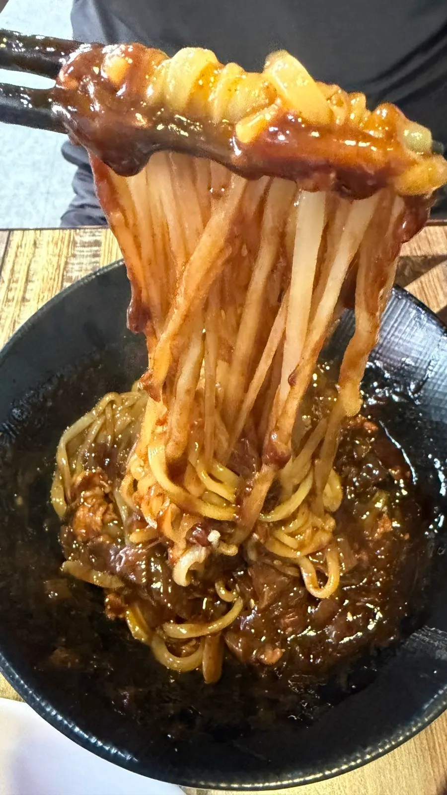 Vertical close-up of mixed ulzzajang noodles