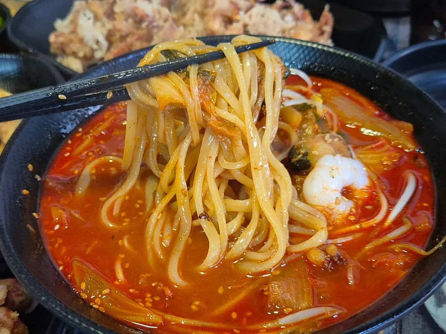 24-hour aged house-made noodles lifted from the bowl
