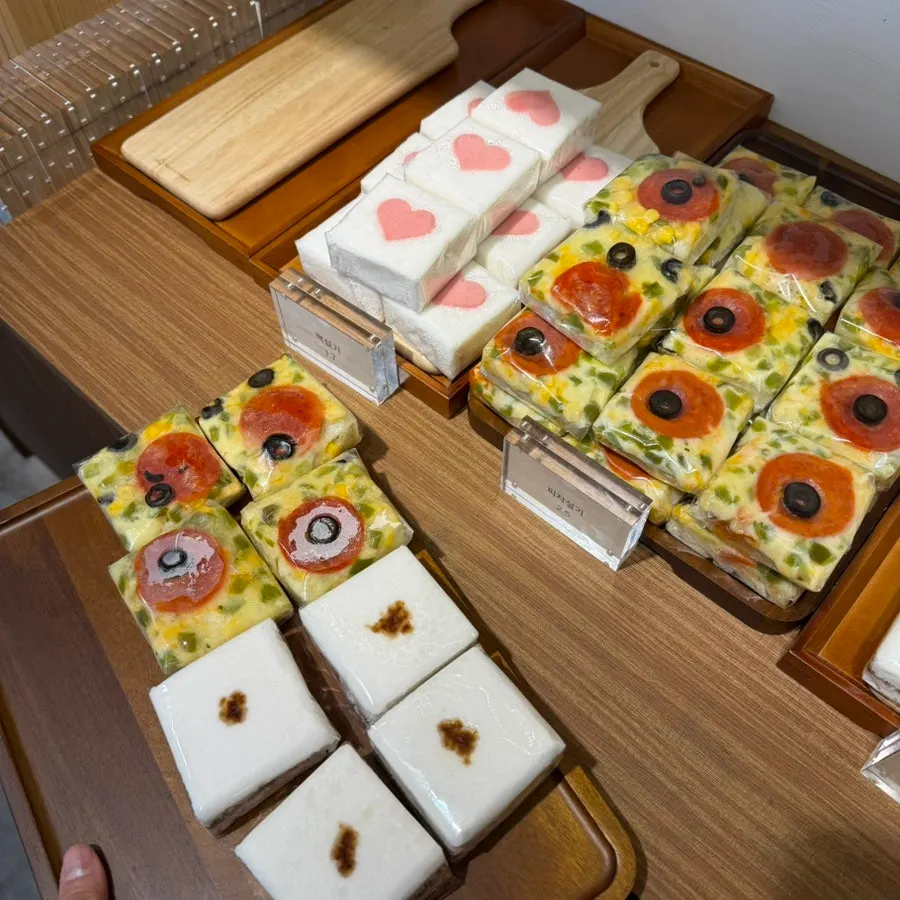 Various rice cakes displayed on shelves