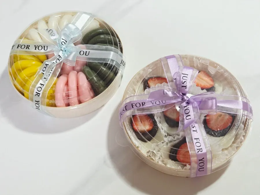Preordered flat honey tteok and strawberry mochi picked up at Tteokmama