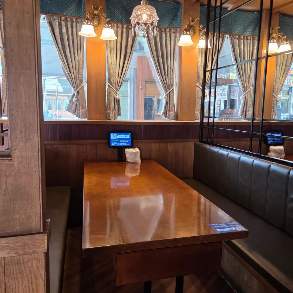 Terrace seating and indoor sink on one side of the restaurant