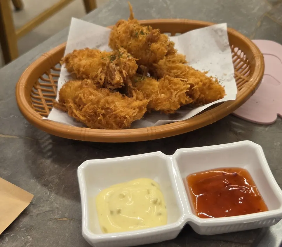 Handmade fried monkfish served with chili sauce