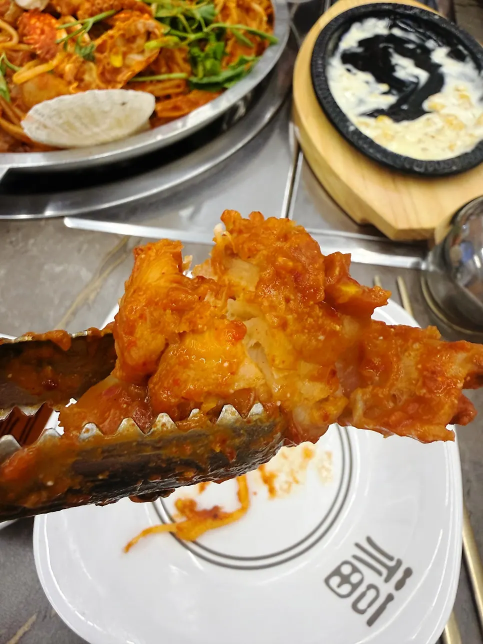 Full view of the hot-plate monkfish seafood stew