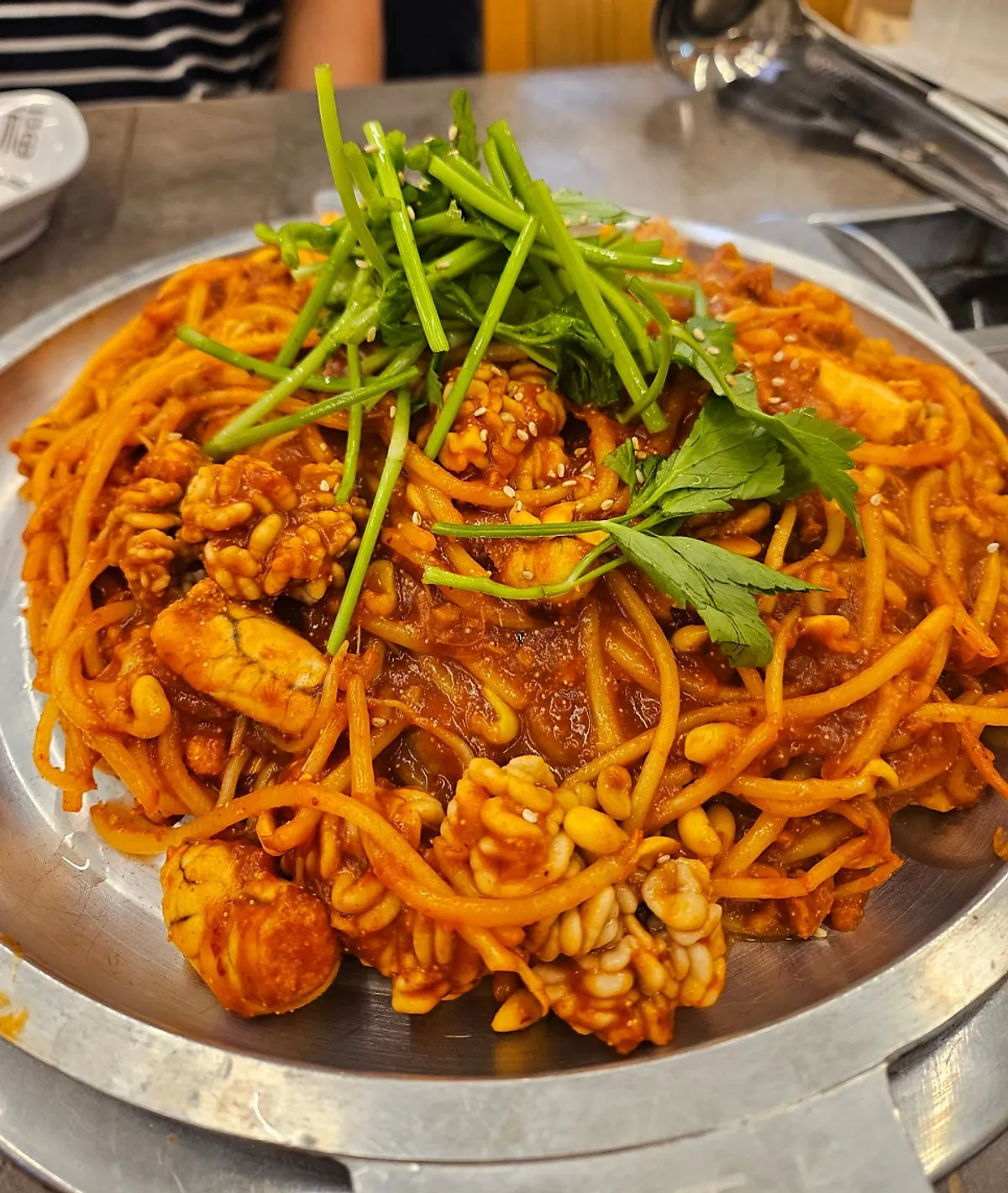 Algoni jjim and bean sprouts on a hot plate