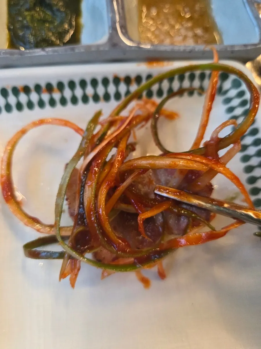 King salt pork belly grilled over charcoal briquettes